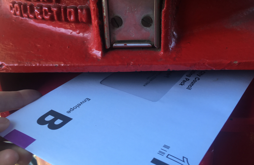 Postal vote being posted in post box